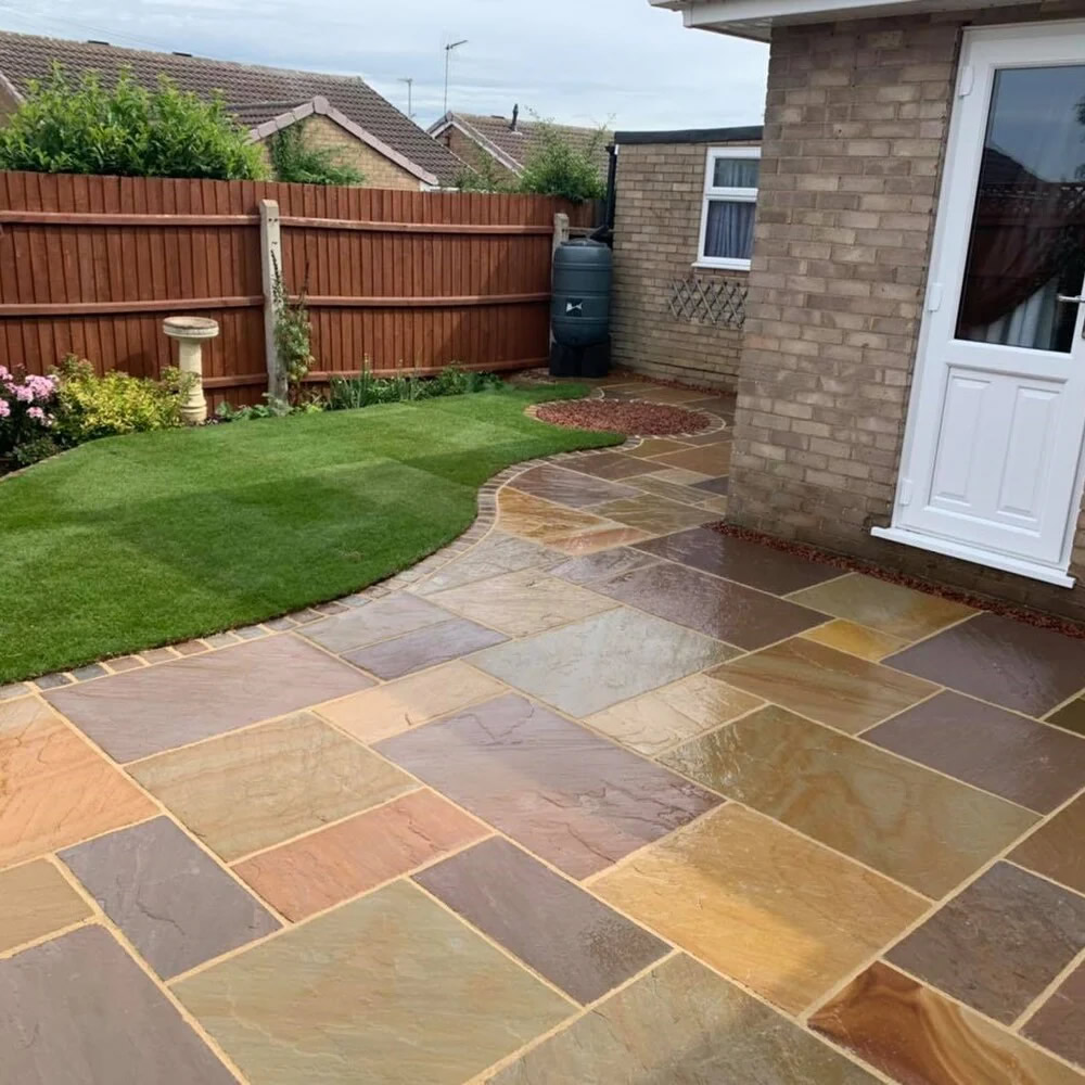 Natural stone patio by F DORAN GARDENS & PATIOS is a trading style of GARDENS AND PATIOS NW LTD