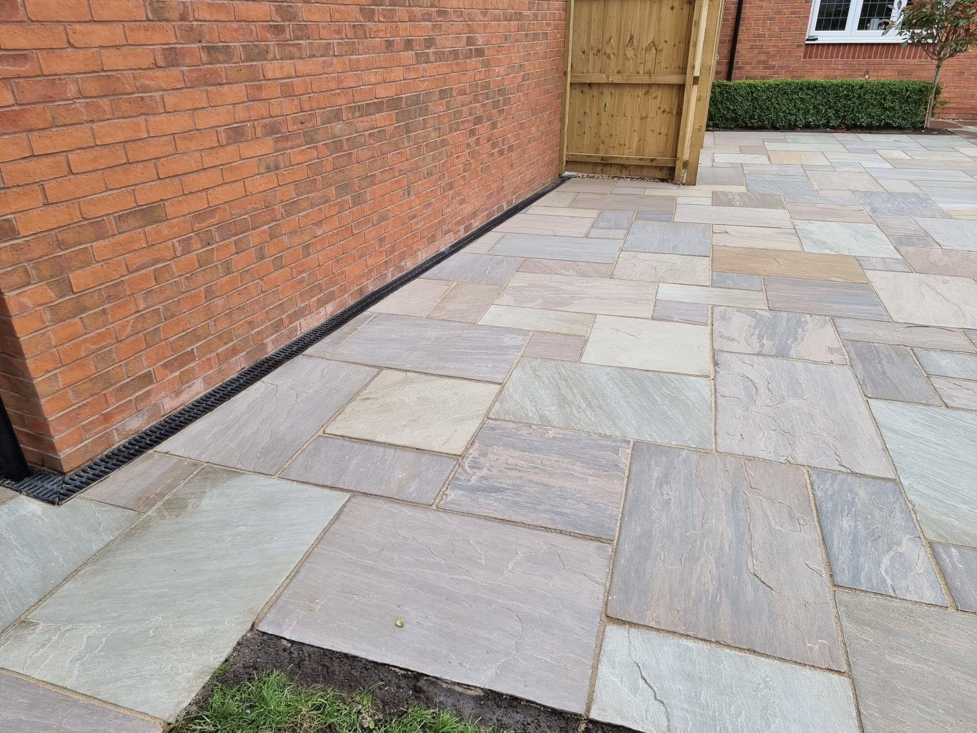 Indian sandstone patio design by F DORAN GARDENS & PATIOS is a trading style of GARDENS AND PATIOS NW LTD